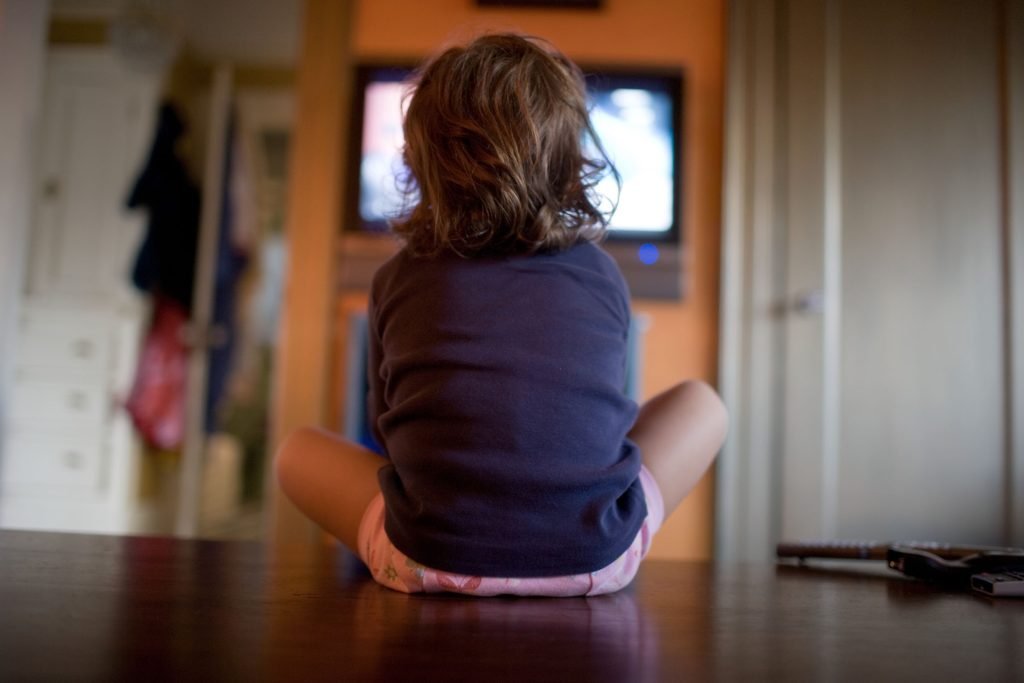 Young girl watching television